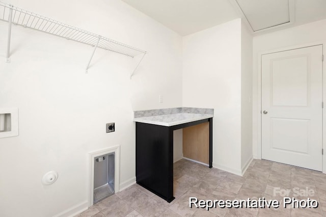 clothes washing area featuring laundry area, baseboards, and hookup for an electric dryer