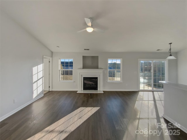 unfurnished living room with dark wood-type flooring and ceiling fan