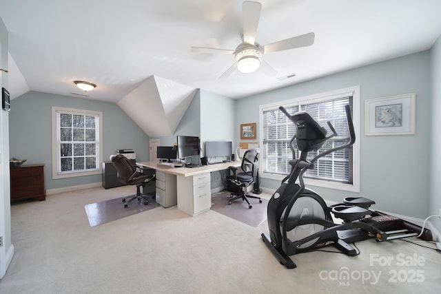 office area with baseboards, visible vents, a ceiling fan, light colored carpet, and lofted ceiling