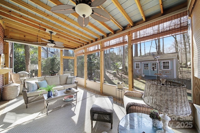 sunroom featuring ceiling fan