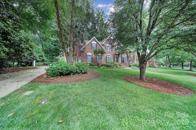 907 Thorn Ridge Ln, Lake Wylie, SC 29710 - traditional-style house featuring brick siding and a front lawn