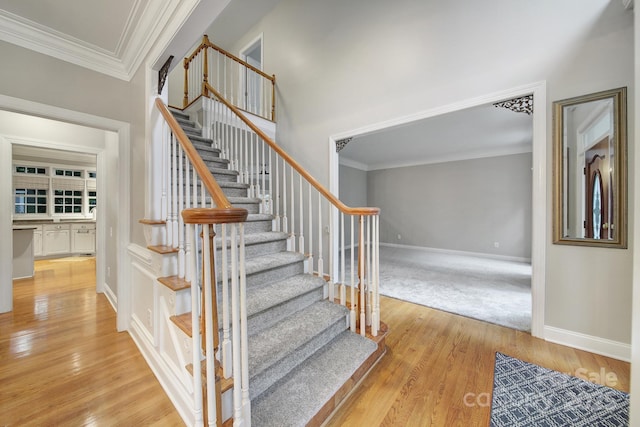 907 Thorn Ridge Ln, Lake Wylie, SC 29710 - staircase featuring crown molding, baseboards, and wood finished floors