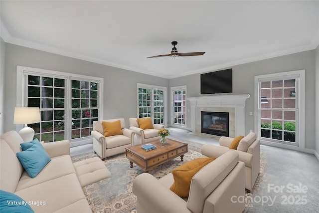 907 Thorn Ridge Ln, Lake Wylie, SC 29710 - carpeted living room featuring a ceiling fan, ornamental molding, and a fireplace