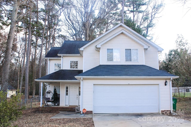 view of front property featuring a garage and covered porch