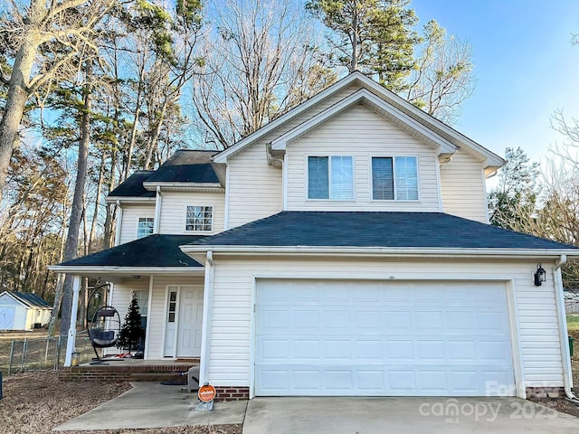 view of front of property featuring a garage and covered porch