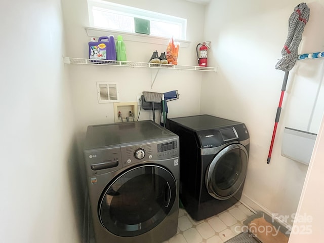 laundry area featuring separate washer and dryer