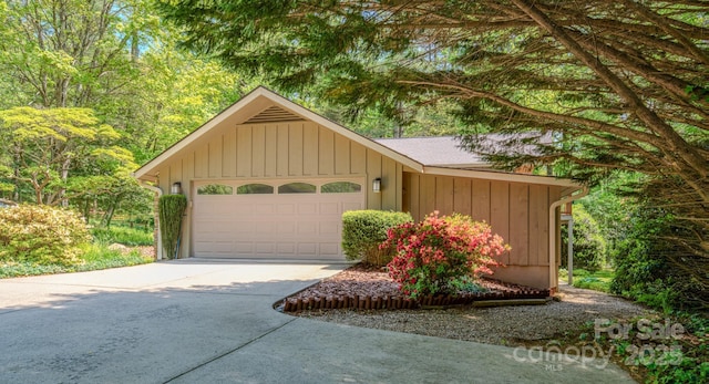 garage with concrete driveway