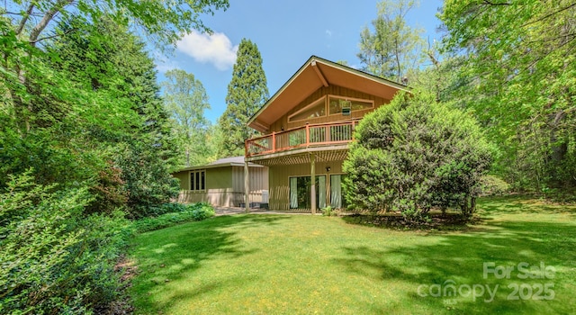 back of property featuring a lawn