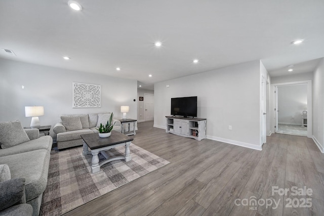 living room with light hardwood / wood-style floors