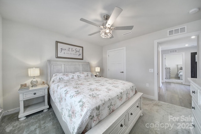 bedroom with dark carpet and ceiling fan