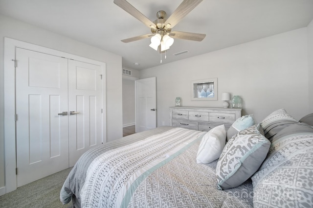 bedroom featuring light carpet, a closet, and ceiling fan