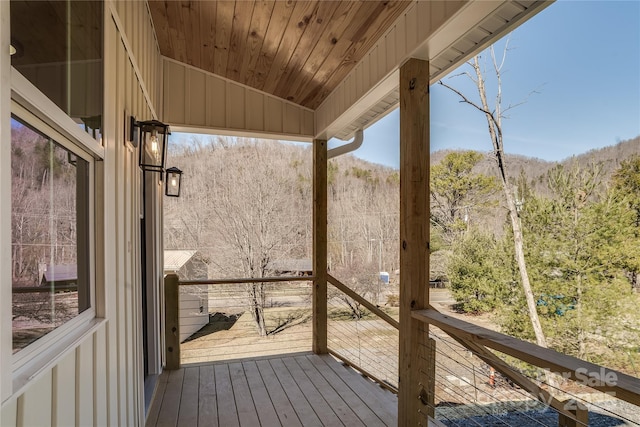 deck featuring a wooded view