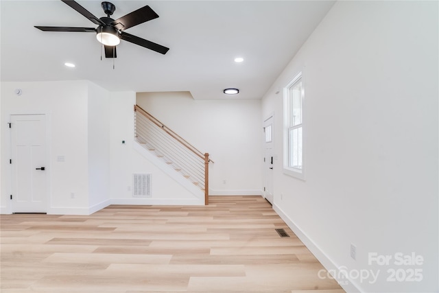 foyer entrance featuring stairway, visible vents, light wood-style floors, and recessed lighting