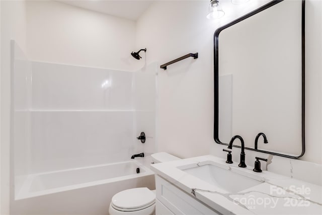 full bath with shower / tub combination, vanity, and toilet