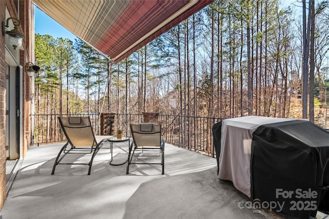 view of patio with a balcony and area for grilling