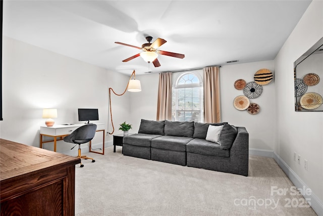 living room featuring ceiling fan and light carpet