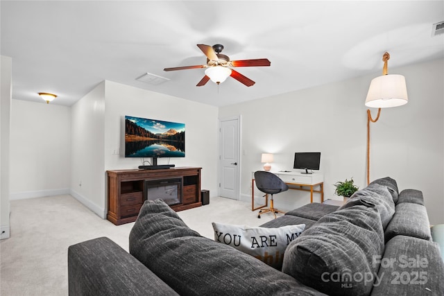 living room with light carpet and ceiling fan