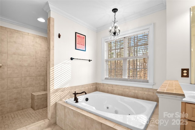 bathroom with tiled tub, vanity, ornamental molding, and a notable chandelier