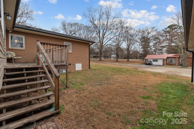 view of yard featuring a wooden deck