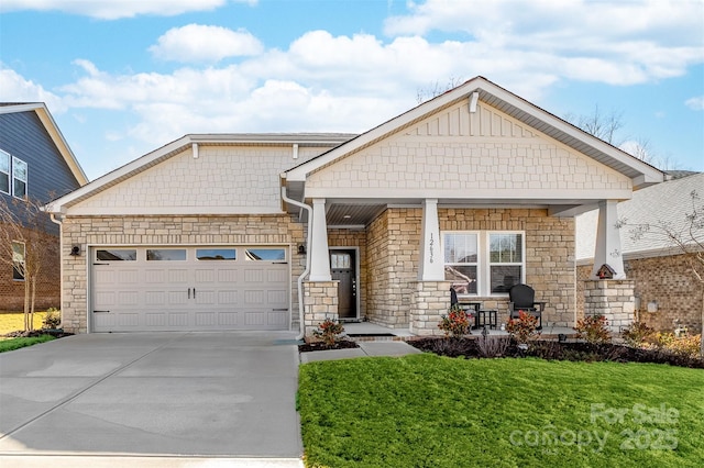 craftsman-style house featuring a porch, a garage, and a front yard