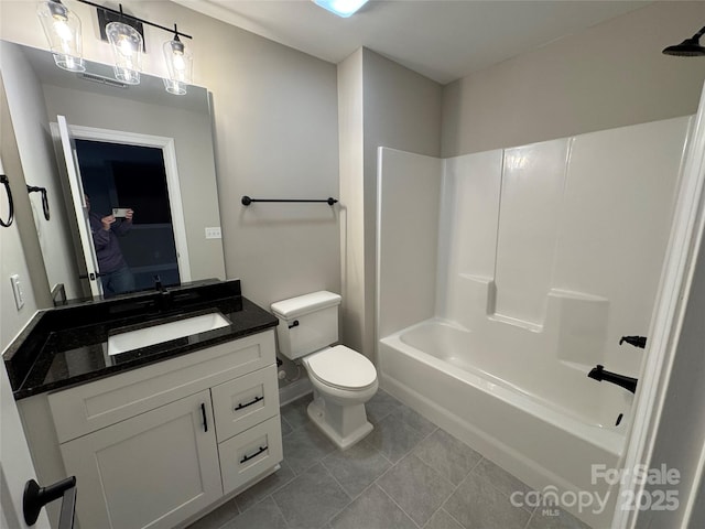 full bathroom with toilet, tile patterned floors, vanity, and bathtub / shower combination