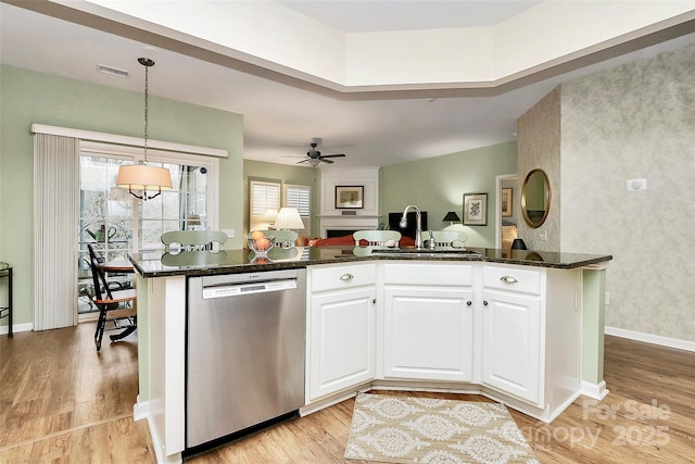 9119 Gander Dr, Charlotte, NC 28277 - kitchen featuring white cabinets, light hardwood / wood-style flooring, sink, and dishwasher