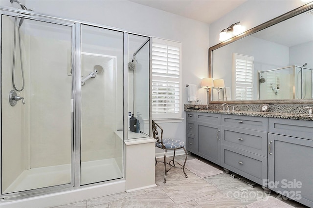 9119 Gander Dr, Charlotte, NC 28277 - bathroom with vanity, a healthy amount of sunlight, and an enclosed shower