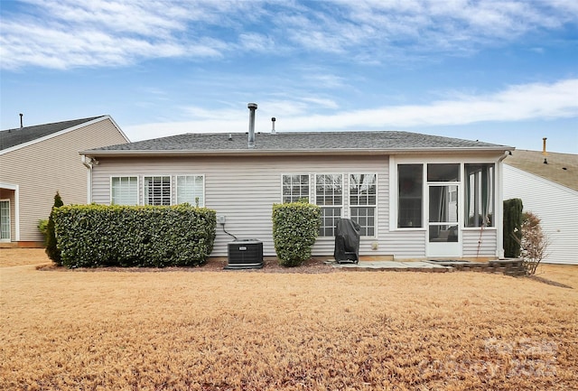 9119 Gander Dr, Charlotte, NC 28277 - rear view of house with cooling unit, a lawn, and a sunroom