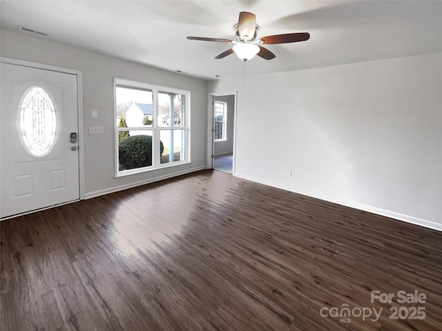 foyer entrance with dark hardwood / wood-style flooring and ceiling fan