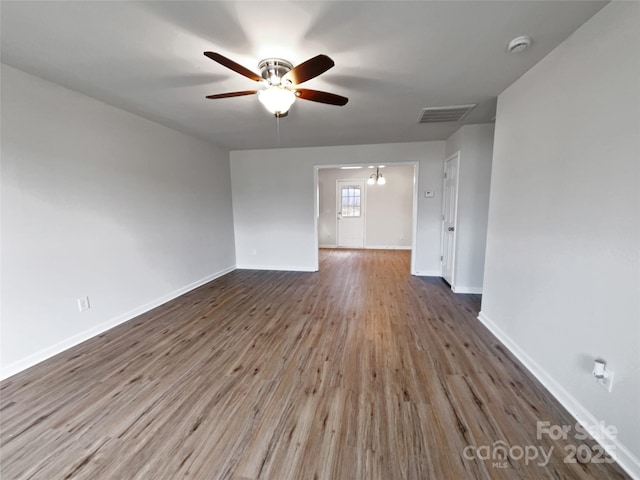 unfurnished room featuring ceiling fan and hardwood / wood-style floors