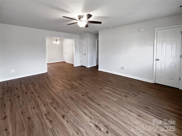 unfurnished room with dark hardwood / wood-style floors and ceiling fan