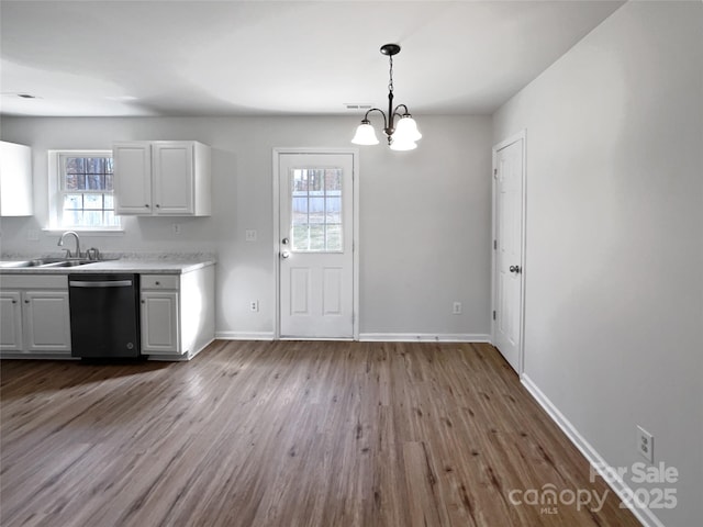 kitchen featuring white cabinetry, dishwasher, sink, and light hardwood / wood-style flooring