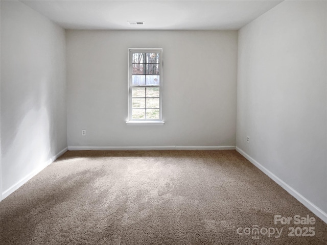 unfurnished room with carpet floors