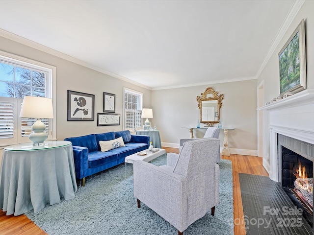 living room featuring ornamental molding, a healthy amount of sunlight, and hardwood / wood-style floors