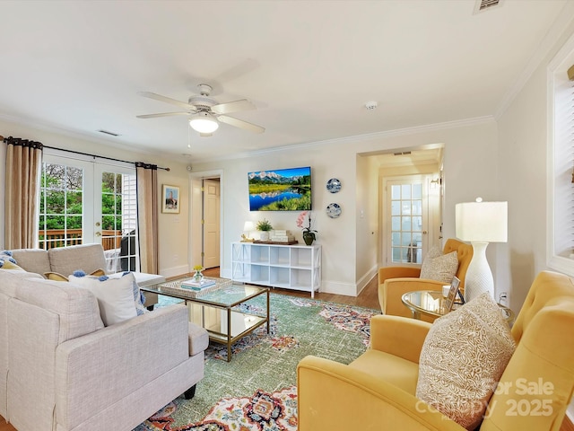 living room featuring french doors, ceiling fan, ornamental molding, and hardwood / wood-style floors