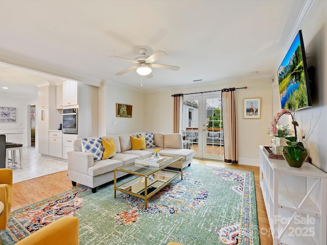 living room featuring french doors, ceiling fan, and ornamental molding