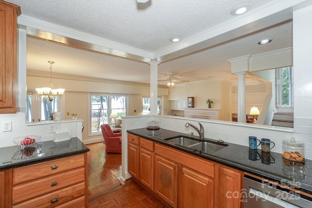 405 NW Dr, Davidson, NC 28036 - kitchen featuring sink, crown molding, dark parquet floors, pendant lighting, and dark stone counters