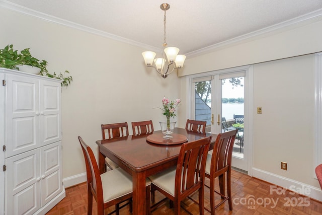 405 NW Dr, Davidson, NC 28036 - dining room with parquet floors, ornamental molding, and a notable chandelier