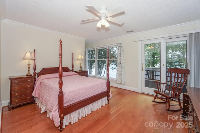 405 NW Dr, Davidson, NC 28036 - bedroom featuring light hardwood / wood-style flooring, a textured ceiling, ornamental molding, ceiling fan, and access to exterior