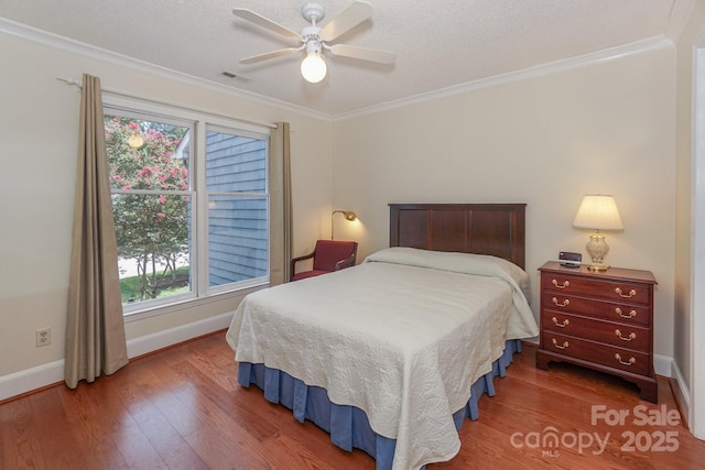 405 NW Dr, Davidson, NC 28036 - bedroom with hardwood / wood-style flooring, ornamental molding, a textured ceiling, and ceiling fan