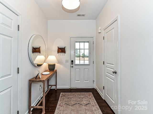 entryway with dark wood-type flooring