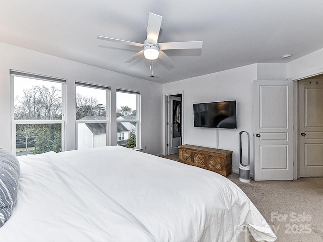 carpeted bedroom with ceiling fan