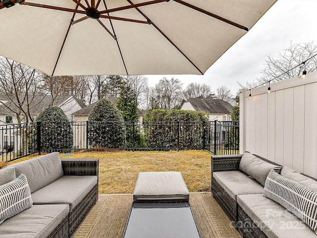 view of patio with ceiling fan and an outdoor hangout area