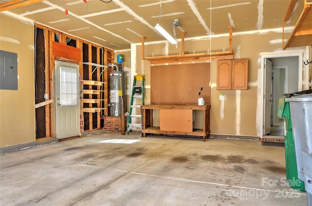 garage featuring gas water heater and electric panel