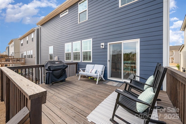 wooden deck featuring grilling area