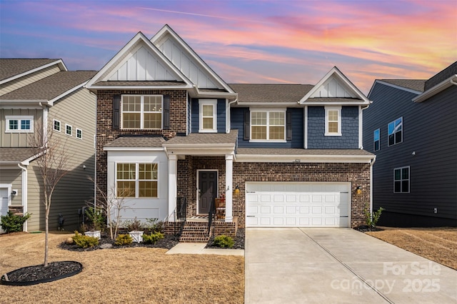 view of front of home featuring a garage, driveway, brick siding, and board and batten siding