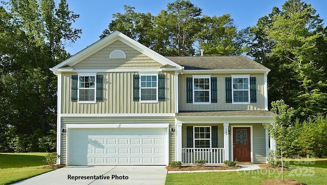 view of front of property with a garage, covered porch, and a front lawn