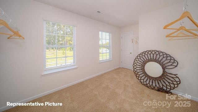 living area with light carpet