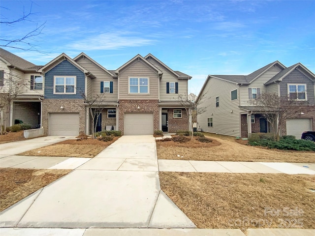 townhome / multi-family property featuring a garage