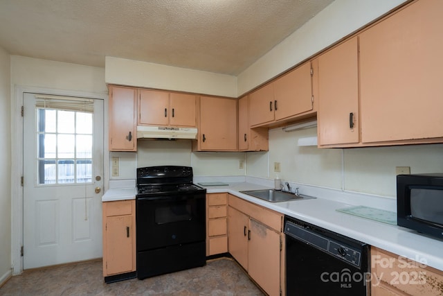 kitchen with under cabinet range hood, light countertops, black appliances, a textured ceiling, and a sink